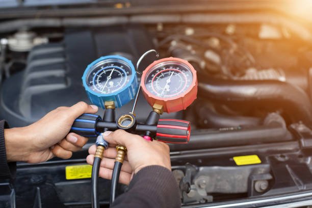 Technician is checking air conditioner. Technician is checking air conditioner.