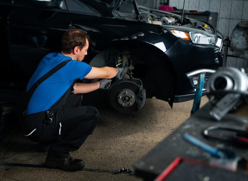 male-mechanic-working-auto-repair-shop-car (1)